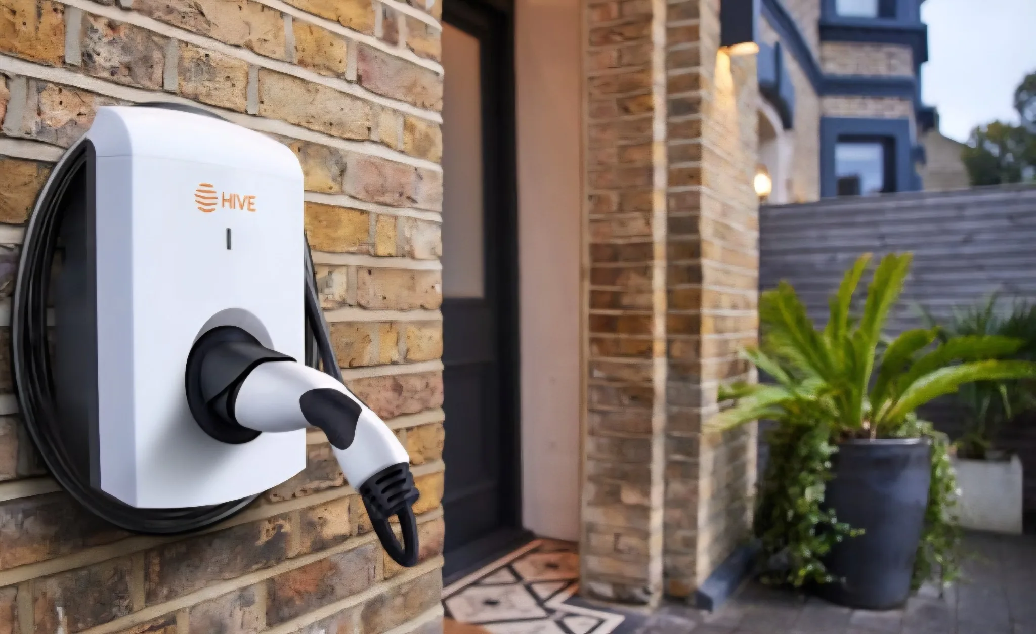 Home EV charging point fitted to an exterior wall